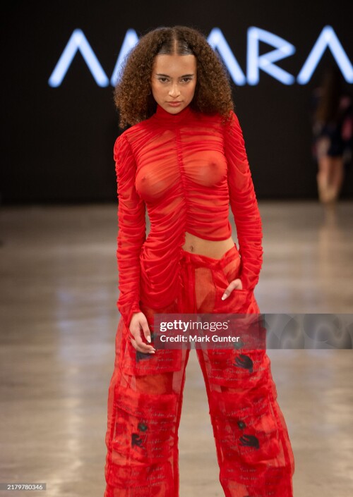 LOS ANGELES, CALIFORNIA - OCTOBER 19: (EDITOR'S NOTE: Image contains nudity.) A model walks the runway at the Amara Art Fashion show during Los Angeles Fashion Week powered by Art Hearts Fashion at The New Mart on October 19, 2024 in Los Angeles, California. (Photo by Mark Gunter/Getty Images for Art Hearts Fashion)