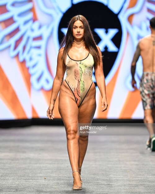 MIAMI BEACH, FLORIDA - JULY 06: A model walks the runway wearing Mister Triple X during Miami Swim Week Powered by Art Hearts Fashion at Fontainebleau Hotel on July 06, 2023 in Miami Beach, Florida. (Photo by Arun Nevader/Getty Images for Art Hearts Fashion)