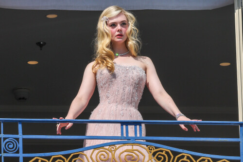 Elle Fanning is seen at the Martinez hotel during the 75th annual Cannes Film Festival on May 18, 2022 in Cannes, France. She wearing a white dress at Martinez balcony.
