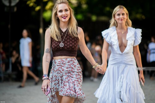 PARIS, FRANCE - JULY 02: Chiara Ferragni wearing cropped top, skirt and Valentina Ferragni wearing white dress seen outside Giambattista Valli on day two during Paris Fashion Week Haute Couture FW18 on July 2, 2018 in Paris, France. (Photo by Christian Vierig/Getty Images)