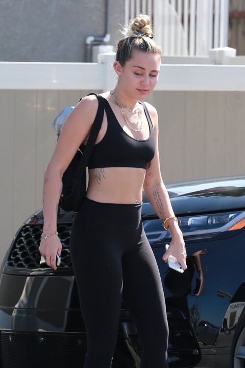 73692649 miley cyrus shows off her fit 0008