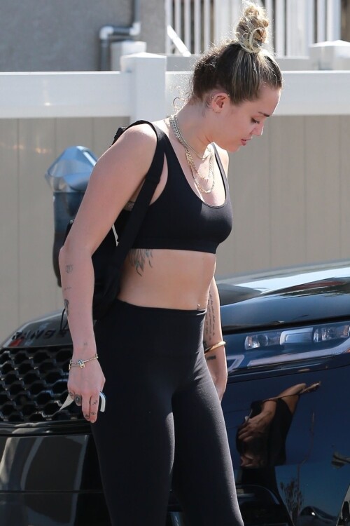 73692686 miley cyrus shows off her fit 0010