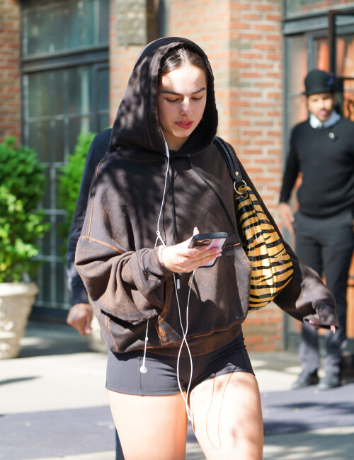 26 May 2023 - EXCLUSIVE.Addison Rae is pictured stepping out in New York City. The 22 year old American model wore a brown hoodie paired with short black Bicycle shorts and white trainers.Credit: GoffPhotos.com   Ref: KGC-339/TIDNY-13**UK Sales Only - No Daily Mail Group/No Sun Group - Exclusive - Newspapers Allrounder - Magazines Double Space Rates - Web/Online Must Call Before Use**