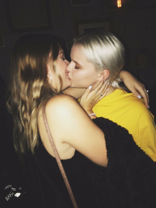 Clare Abbott kissing her blonde friend