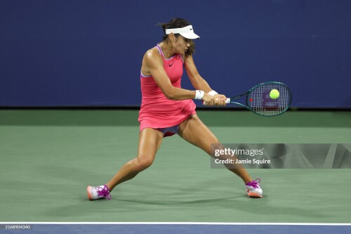 NEW YORK, NEW YORK - AUGUST 27: Emma Raducanu of Great Britain returns against Sofia Kenin of the United States during their Women's Singles First Round match on Day Two of the 2024 US Open at the USTA Billie Jean King National Tennis Center on August 27, 2024 in the Flushing neighborhood of the Queens borough of New York City. (Photo by Jamie Squire/Getty Images)