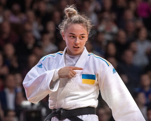 BERCY, FRANCE, 4 FEBRUARY:  World champion and Olympic medalist, Daria Bilodid of Ukraine celebrates winning the u57kg bronze medal after defeating Telma Monteiro of Portugal by pointing to her Ukrainian badge on her judogi as she leaves the mat  during day 1 of the 2023 Paris Judo Grand Slam (4-5 February) at the Accorhotels Arena in Bercy, Paris, France.  (Photo by David Finch/Getty Images)