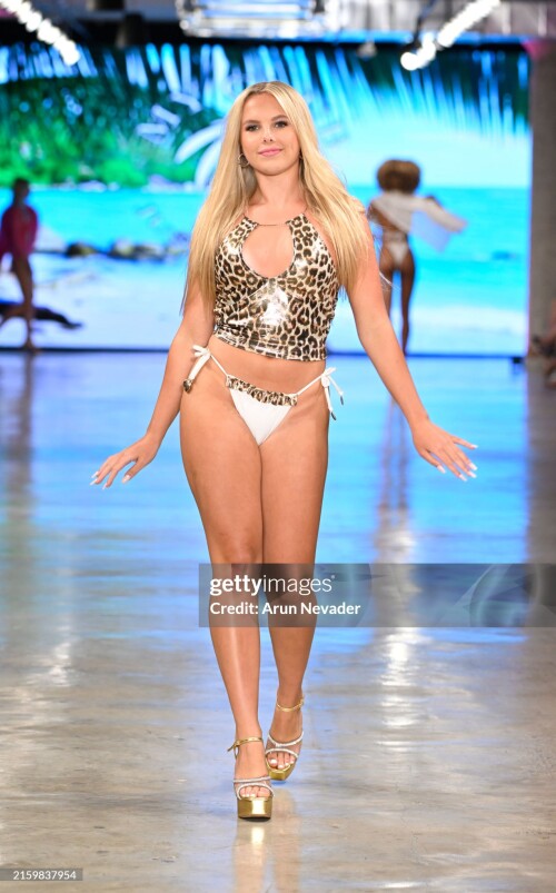 LOS ANGELES, CALIFORNIA - JUNE 28: A model walks the runway for Shop My Club at LA Swim Week 2024 Powered By Art Hearts Fashion at at LA Swim Week 2024 Powered By Art Hearts Fashion at The New Mart on June 28, 2024 in Los Angeles, California. (Photo by Arun Nevader/Getty Images for Art Hearts Fashion)