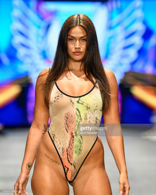 MIAMI BEACH, FLORIDA - JULY 06: A model walks the runway wearing Mister Triple X during Miami Swim Week Powered by Art Hearts Fashion at Fontainebleau Hotel on July 06, 2023 in Miami Beach, Florida. (Photo by Arun Nevader/Getty Images for Art Hearts Fashion)