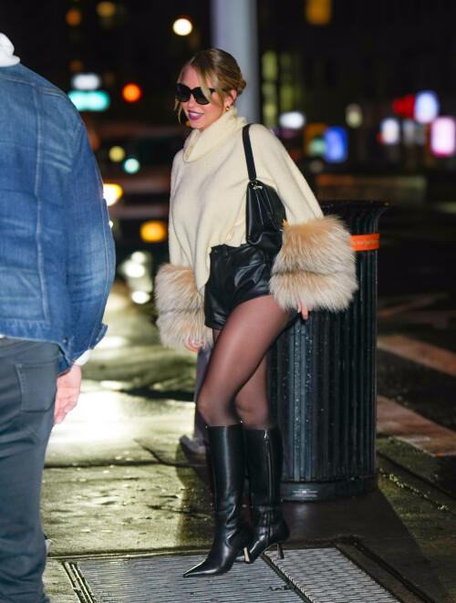 02/27/2024 Sydney Sweeney is spotted returning to her hotel in New York City. The American actress was seen ahead of her SNL hosting gig wearing a sweater with fur trimmed sleeves, black leather Daisy Dukes, and matching knee high boots.sales@theimagedirect.com Please byline:TheImageDirect.com