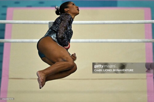 US' Jordan Chiles competes in the uneven bars event of the artistic gymnastics women's qualification during the Paris 2024 Olympic Games at the Bercy Arena in Paris, on July 28, 2024. (Photo by Lionel BONAVENTURE / AFP) (Photo by LIONEL BONAVENTURE/AFP via Getty Images)