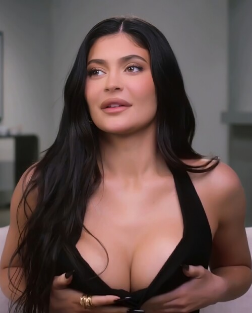 Kylie squeezes her tits