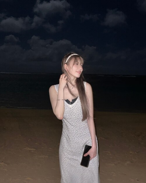 Photo by Sakura Miyawaki on September 24 2024. May be an image of 1 person dress sundress beach ocea