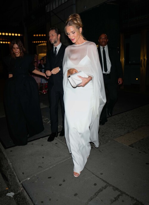 04/26/2025 Rosie Huntington-Whiteley is spotted as she heads to Gigi Hadid's birthday party at L'Avenue in New York City. The 38 year old English model wore a long white dress and heels as she was spotted at the star studded eventsales@theimagedirect.com Please byline:TheImageDirect.com