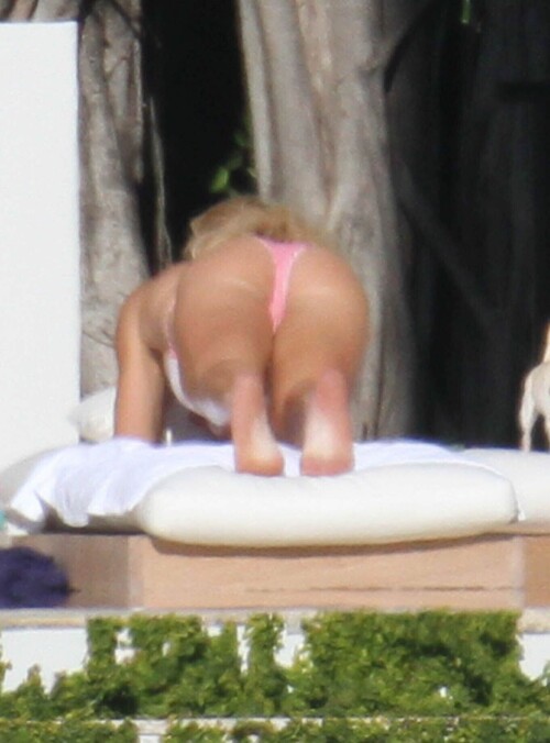 8387319 Athletic couple Alex Rodriguez and Torrie Wilson showed off there muscular figures while enjoying the warn Miami, Florida sun on January 9, 2012. The couple enjoyed tanning together and playing with their little dogs at the ocean front mansion.  The couple just returned from a star-studded vacation in Mexico with George Clooney, Stacy Keibler and Cindy Crawford. FameFlynet, Inc. - Santa Monica, CA, USA - +1 (310) 395-0500