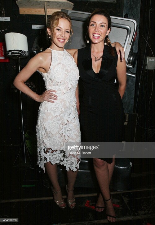 Kylie Minogue and Dannii Minogue pose with cast members backstage following a performance of "Memphis The Musical" at Shaftesbury Theatre on August 22, 2015 in London, England.