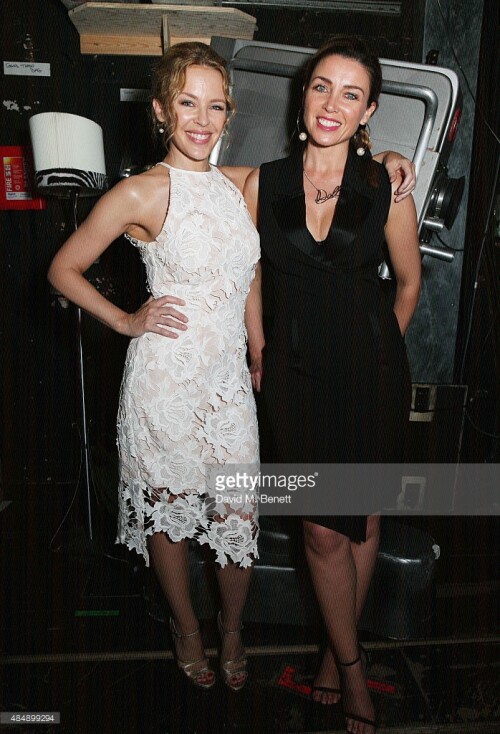 Kylie Minogue and Dannii Minogue pose with cast members backstage following a performance of "Memphis The Musical" at Shaftesbury Theatre on August 22, 2015 in London, England.