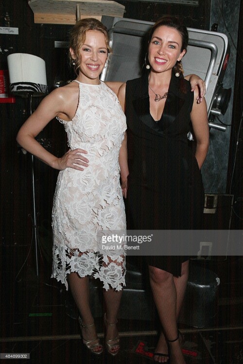 Kylie Minogue and Dannii Minogue pose with cast members backstage following a performance of "Memphis The Musical" at Shaftesbury Theatre on August 22, 2015 in London, England.