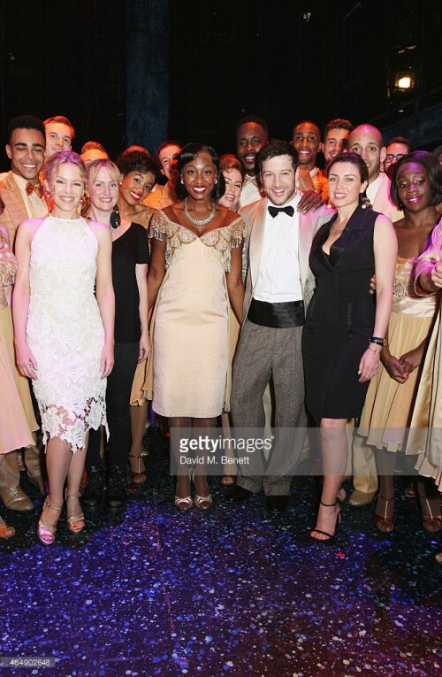 Kylie Minogue and Dannii Minogue pose with cast members backstage following a performance of "Memphis The Musical" at Shaftesbury Theatre on August 22, 2015 in London, England.