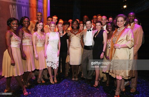 Kylie Minogue and Dannii Minogue pose with cast members backstage following a performance of "Memphis The Musical" at Shaftesbury Theatre on August 22, 2015 in London, England.