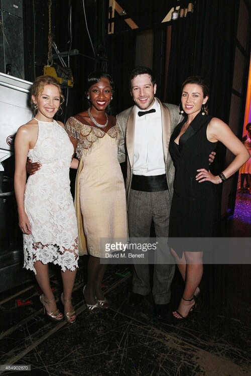 Kylie Minogue and Dannii Minogue pose with cast members backstage following a performance of "Memphis The Musical" at Shaftesbury Theatre on August 22, 2015 in London, England.