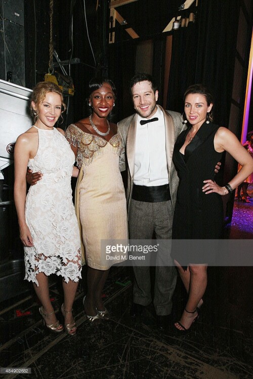 Kylie Minogue and Dannii Minogue pose with cast members backstage following a performance of "Memphis The Musical" at Shaftesbury Theatre on August 22, 2015 in London, England.