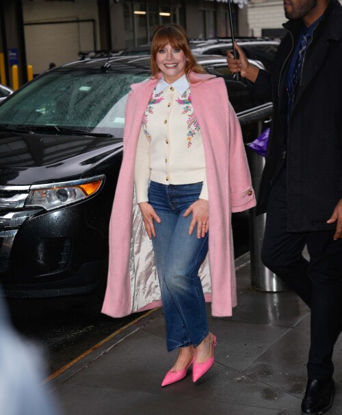 04/07/2025 Bryce Dallas Howard is pictured at ABC studios in New York City. The 44 year old American actress wore a white floral sweater under a long pink coat paired with denim jeans and pink heels. Bryce was later spotted in a black top paired with a tan pattern skirtsales@theimagedirect.com Please byline:TheImageDirect.com