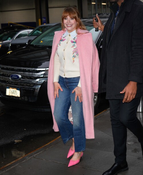 04/07/2025 Bryce Dallas Howard is pictured at ABC studios in New York City. The 44 year old American actress wore a white floral sweater under a long pink coat paired with denim jeans and pink heels. Bryce was later spotted in a black top paired with a tan pattern skirtsales@theimagedirect.com Please byline:TheImageDirect.com
