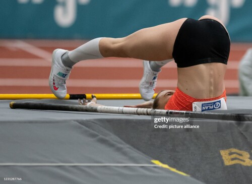 20 February 2021, North Rhine-Westphalia, Dortmund: Athletics: German Championships, in the Rudolf-K?rnig-Halle. Lisa Ryzih lies upside down on the mat during the women's pole vault. She won the title, but missed the qualification for the European Championships. Photo: Bernd Thissen/dpa (Photo by Bernd Thissen/picture alliance via Getty Images)
