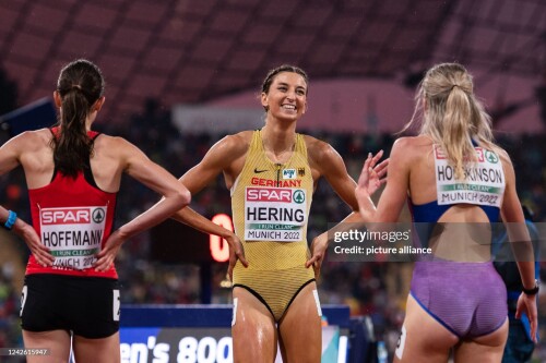 20 August 2022, Bavaria, Munich: Athletics: European Championships, Olympic Stadium, 800m, women, final. Christina Hering (M, Germany) talks with first-place finisher Keely Hodgkinson (r, Great Britain) at the finish line. Photo: Marius Becker/dpa (Photo by Marius Becker/picture alliance via Getty Images)