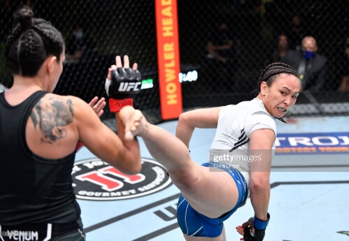 LAS VEGAS, NEVADA - MAY 08: (R-L) Michelle Waterson kicks Marina Rodriguez of Brazil in a flyweight fight during the UFC Fight Night event at UFC APEX on May 08, 2021 in Las Vegas, Nevada. (Photo by Chris Unger/Zuffa LLC)
