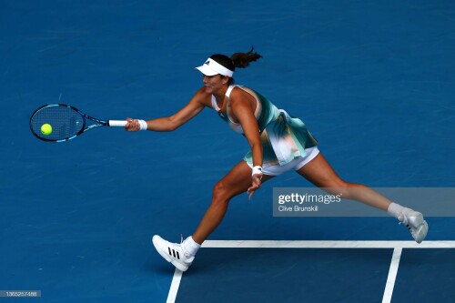 MELBOURNE, AUSTRALIA - JANUARY 18: Garbine Muguruza of Spain plays a forehand in her first round singles match against Clara Burel of France during day two of the 2022 Australian Open at Melbourne Park on January 18, 2022 in Melbourne, Australia. (Photo by Clive Brunskill/Getty Images)