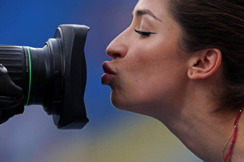 SILESIA, POLAND - JUNE 23:  Ewa Swoboda of Team Poland celebrates after she crosses the finish line by kissing the tv camera in the Women's 100m - Division 1 in the 2023 European Team Championships during day four of the European Games 2023 at Slaski Stadium on June 23, 2023 in Silesia, Poland. (Photo by Dean Mouhtaropoulos/Getty Images for European Athletics)