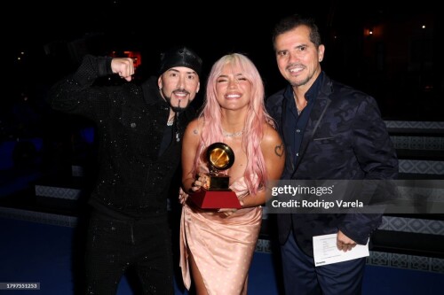 SEVILLE, SPAIN - NOVEMBER 16: Karol G, John Leguizamo, and Yandel pose with the Best Urban Music Album award during The 24th Annual Latin Grammy Awards on November 16, 2023 in Seville, Spain. (Photo by Rodrigo Varela/Getty Images for Latin Recording Academy)