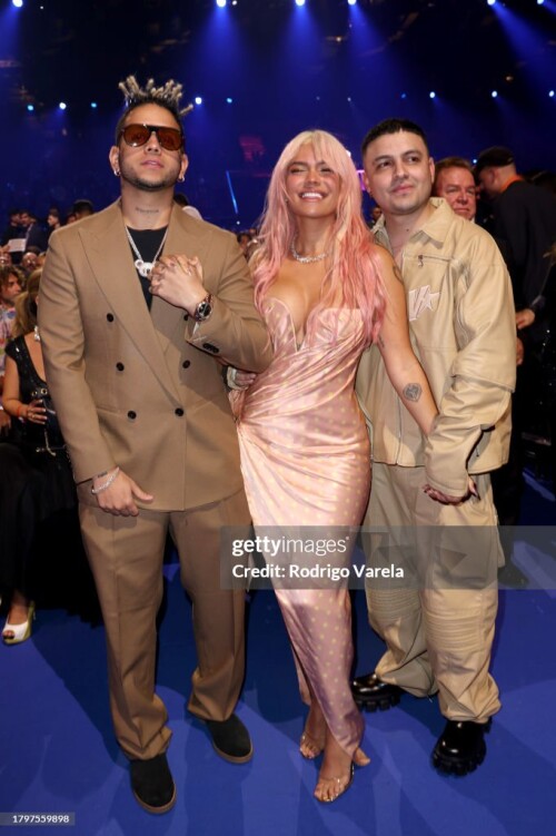 SEVILLE, SPAIN - NOVEMBER 16: (L-R) Ovy On The Drums, Karol G and Kevyn Mauricio Cruz attend The 24th Annual Latin Grammy Awards on November 16, 2023 in Seville, Spain. (Photo by Rodrigo Varela/Getty Images for Latin Recording Academy)