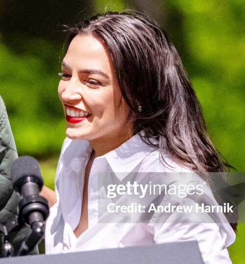TRIANGLE, VIRGINIA - APRIL 22: Sen. Edward Markey (D-MA) welcomes Rep. Alexandria Ocasio-Cortez (D-NY) to the stage before U.S. President Joe Biden joins them on Earth Day at Prince William Forest Park on April 22, 2024 in Triangle, Virginia. Biden, along with Sens. Bernie Sanders (D-VT), Edward Markey (D-MA), and Rep. Alexandria Ocasio-Cortez (D-NY), announced a seven billion dollar "Solar For All" program with the Environmental Protection Agency and an American Climate Corps initiative, while commemorating the 54th anniversary of Earth Day, started in 1970 to raise awareness and support for environmental protection. (Photo by Andrew Harnik/Getty Images)