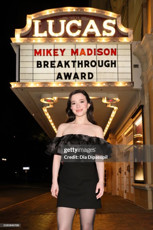 SAVANNAH, GEORGIA - OCTOBER 29: Mikey Madison poses in front of the marquee ahead of a screening of "Anora" and Breakthrough Award presentation during the 27th SCAD Savannah Film Festival at Lucas Theatre for the Arts on October 29, 2024 in Savannah, Georgia. (Photo by Dia Dipasupil/Getty Images for SCAD)