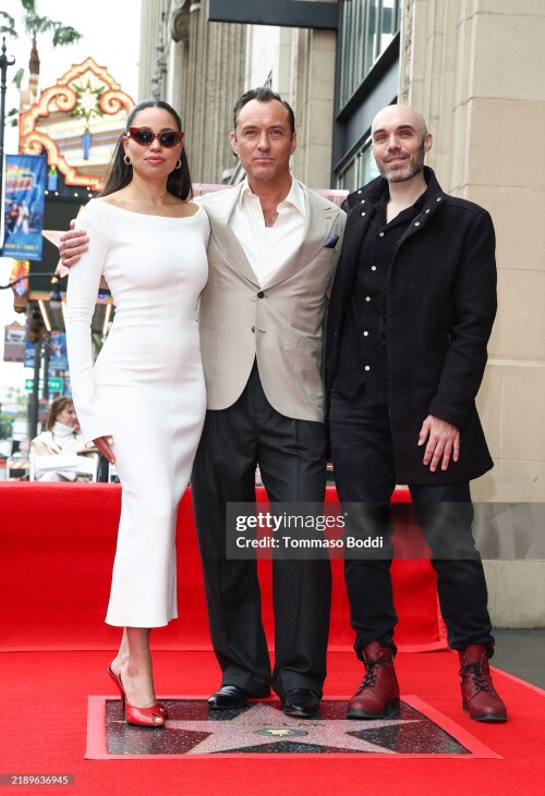 HOLLYWOOD, CALIFORNIA - DECEMBER 12: (L-R) Jurnee Smollett, Jude Law and David Lowery attend Jude Law's Hollywood Walk of Fame Star Ceremony on December 12, 2024 in Hollywood, California. (Photo by Tommaso Boddi/Getty Images)