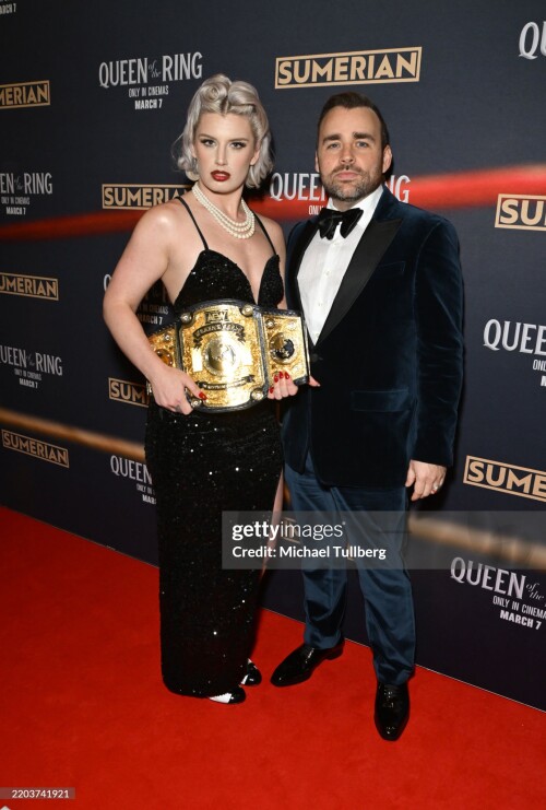 LOS ANGELES, CALIFORNIA - MARCH 06: (L-R) Wrestler Toni Storm and director Ash Avildsen attend the Los Angeles premiere of "Queen Of The Ring" at AMC The Grove 14 on March 06, 2025 in Los Angeles, California. (Photo by Michael Tullberg/Getty Images)