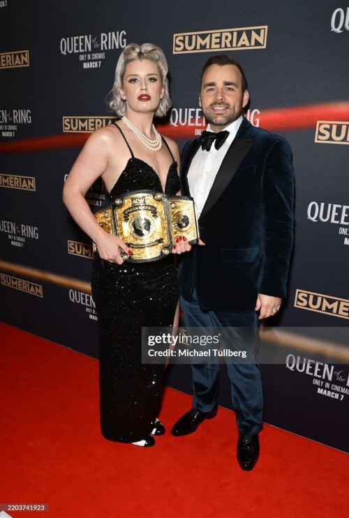 LOS ANGELES, CALIFORNIA - MARCH 06: (L-R) Wrestler Toni Storm and director Ash Avildsen attend the Los Angeles premiere of "Queen Of The Ring" at AMC The Grove 14 on March 06, 2025 in Los Angeles, California. (Photo by Michael Tullberg/Getty Images)