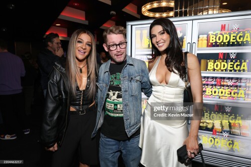 NEW YORK, NEW YORK - MARCH 10: (L-R) Dakota Kai, Macaulay Culkin and Cathy Kelley attend the WWE RAW LIVE ON NETFLIX at Madison Square Garden on March 10, 2025 in New York City. (Photo by Kevin Mazur/Kevin Mazur/ Getty Images For Netflix)
