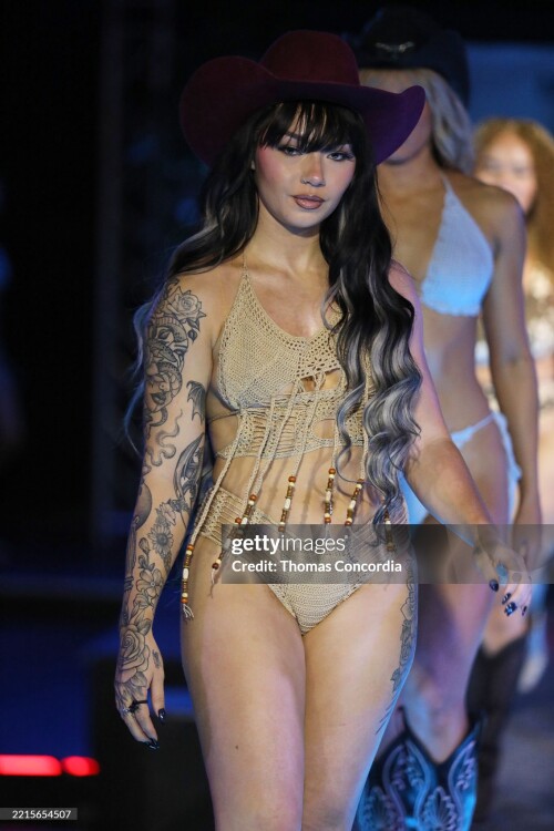 ATLANTA, GEORGIA - MAY 17: A model walks the runway wearing Coastal Smokeshow during the ATLSW Runway Show "Tulum After Dark" at Westside Cultural Arts Center on May 17, 2025 in Atlanta, Georgia. (Photo by Thomas Concordia/Getty Images for Atlanta Swim Week)