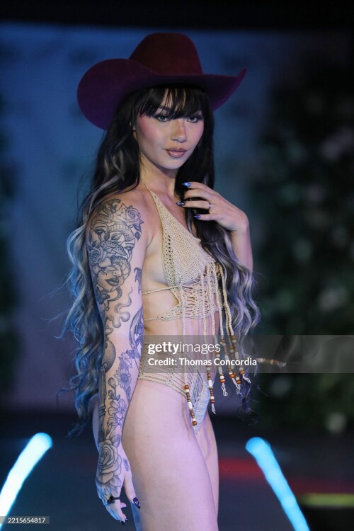 ATLANTA, GEORGIA - MAY 17: A model walks the runway wearing Coastal Smokeshow during the ATLSW Runway Show "Tulum After Dark" at Westside Cultural Arts Center on May 17, 2025 in Atlanta, Georgia. (Photo by Thomas Concordia/Getty Images for Atlanta Swim Week)