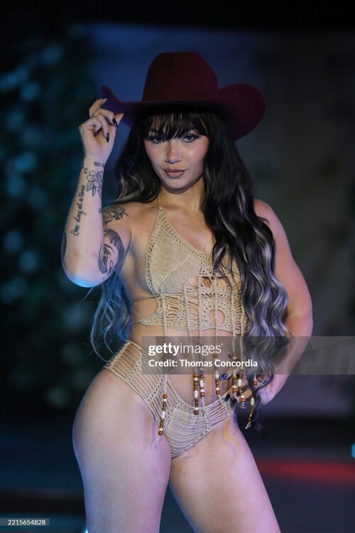 ATLANTA, GEORGIA - MAY 17: A model walks the runway wearing Coastal Smokeshow during the ATLSW Runway Show "Tulum After Dark" at Westside Cultural Arts Center on May 17, 2025 in Atlanta, Georgia. (Photo by Thomas Concordia/Getty Images for Atlanta Swim Week)