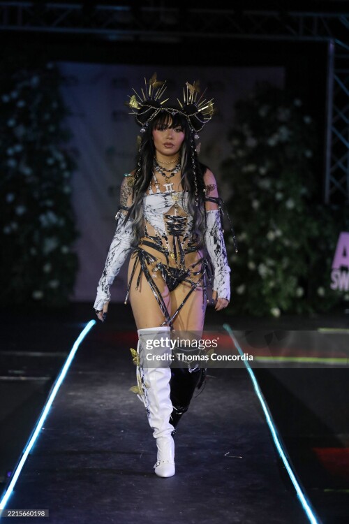 ATLANTA, GEORGIA - MAY 17: A model walks the runway wearing Whimsy Forge during the ATLSW Runway Show "Tulum After Dark" at Westside Cultural Arts Center on May 17, 2025 in Atlanta, Georgia. (Photo by Thomas Concordia/Getty Images for Atlanta Swim Week)
