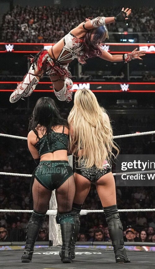 PHOENIX, ARIZONA - JUNE 9: Kairi Sane dives onto Roxanne Perez and Liv Morgan during Monday Night RAW at PHX Arena on June 9, 2025 in Phoenix, Arizona.  (Photo by Craig Ambrosio/WWE via Getty Images)