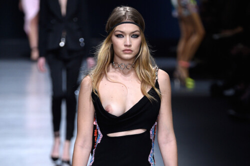 MILAN, ITALY - FEBRUARY 26:  (EDITORS NOTE: Image contains nudity.) Gigi Hadid walks the runway at the Versace show during Milan Fashion Week Fall/Winter 2016/17 on February 26, 2016 in Milan, Italy.  (Photo by Pietro D'aprano/Getty Images)