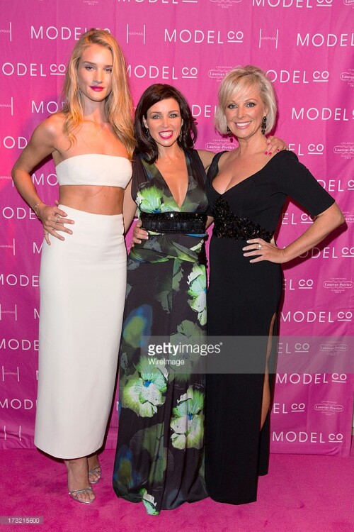 HAYMAN ISLAND, AUSTRALIA - JULY 10:   Rosie Huntington-Whiteley, Dannii Minogue and Company Founder Shelley Barrett arrive at a black tie dinner hosted by ModelCo on Hayman Island in celebration of their new celebrity ambassador signing, Rosie Huntington-Whiteley on July 10, 2013 in Hayman Island, Australia.  (Photo by Caroline McCredie/WireImage)