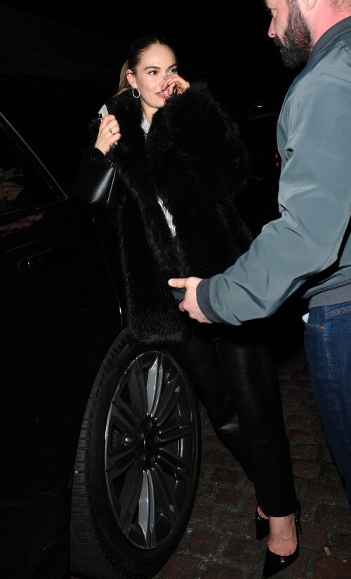 20 December 2024 - EXCLUSIVE.Actress Lily James appears worse for wear as she is seen leaving the Chiltern Firehouse London at 4am with Airbnb Co Founder and CEO Brian Chesky. Brian is the 355th richest person in the world according to Forbes, with a net worth of $7.8 billion. The pair attempted to sneak out the back of the Chiltern Firehouse with Chesky attempting to cover his face as they entered a waiting Range Rover. Credit: GoffPhotos.com   Ref: KGC-29/49/305/453**Exclusive to GoffPhotos.com - Newspapers To Agree - Magazines Double Space Rates Minimum Fee of 350 - ONLINE/WEB MUST CALL BEFORE USE - ONLINE EMBARGOED UNTIL 23:00 22/12/24**