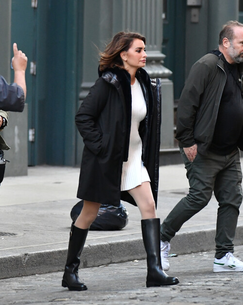 20 April 2024 - EXCLUSIVE.Penelope Cruz strikes a pose during a photoshoot in the SoHo neighborhood on New York City. The 49 year old Spanish actress modeled a black jacket, white dress, and black boots for the Geox fashion label.Credit: GoffPhotos.com   Ref: KGC-339/TIDNY-195**UK Sales Only - No Daily Mail Group/No Sun Group - Exclusive - Newspapers Allrounder - Magazines Double Space Rates - Web/Online Must Call Before Use**