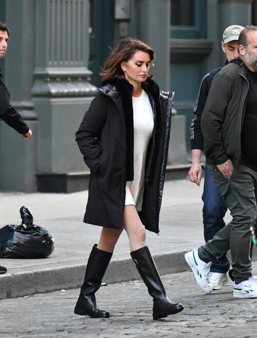 20 April 2024 - EXCLUSIVE.Penelope Cruz strikes a pose during a photoshoot in the SoHo neighborhood on New York City. The 49 year old Spanish actress modeled a black jacket, white dress, and black boots for the Geox fashion label.Credit: GoffPhotos.com   Ref: KGC-339/TIDNY-195**UK Sales Only - No Daily Mail Group/No Sun Group - Exclusive - Newspapers Allrounder - Magazines Double Space Rates - Web/Online Must Call Before Use**